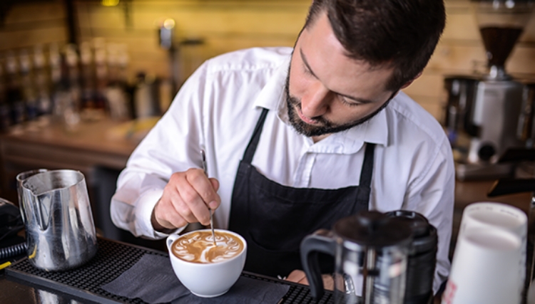 Barista making coffee with Pentair Specialty Coffee Solutions