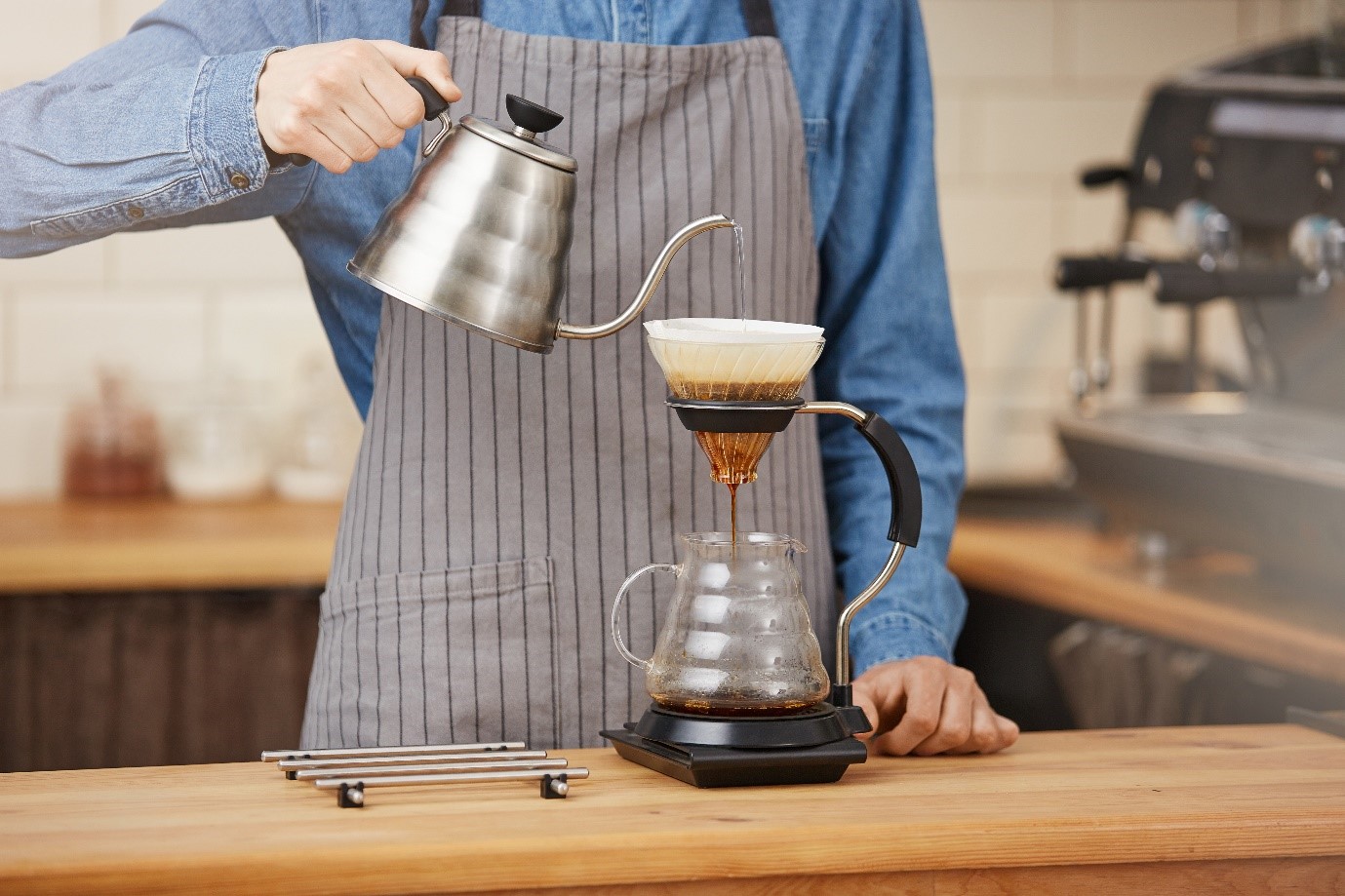 Barista making pourover powered by Pentair Foodservice Water Filtration Systems for Specialty Coffees & Cafes