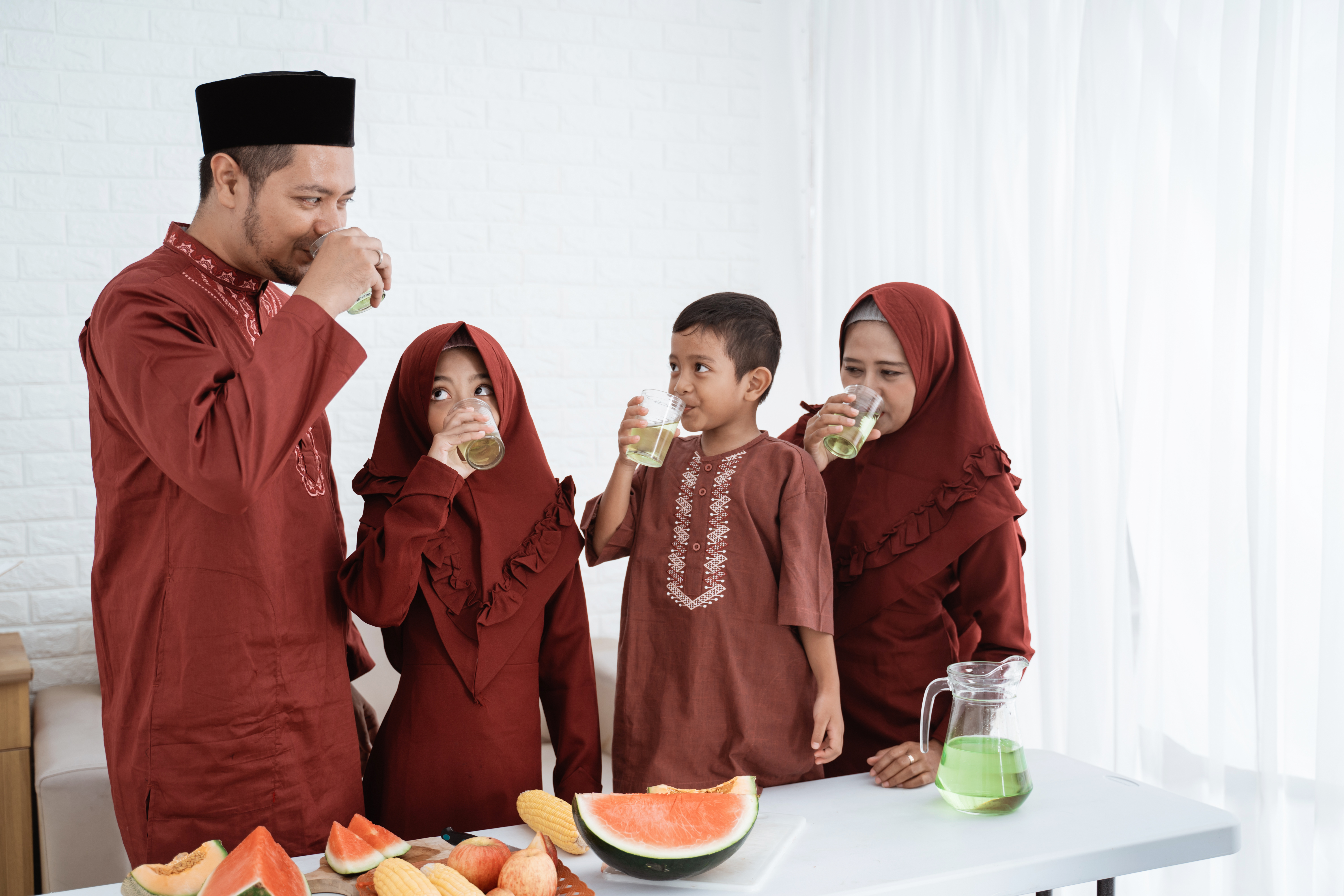 Muslim family drinking water powered by Pentair Water Filter Solutions