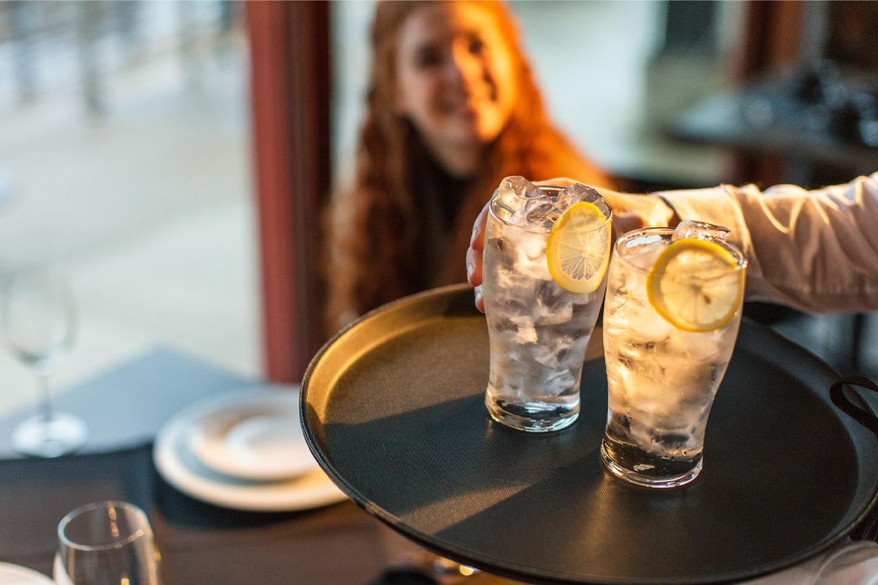 Customer served high quality fresh water in a cafe powered by Pentair Foodservice Water & Ice Solutions